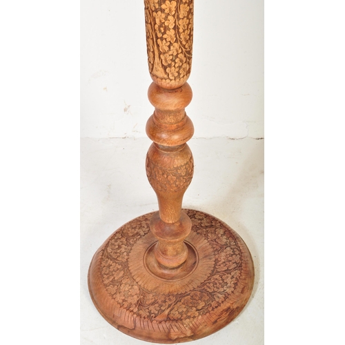 1217 - A mid century Chinese carved hardwood standard lamp raised on carved leaf circular base with carved ... 