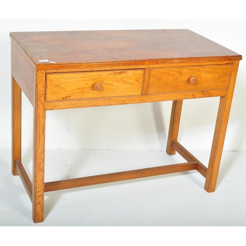 1227 - A retro vintage mid 20th century stamped Air Ministry golden oak office desk. The desk having a stra... 