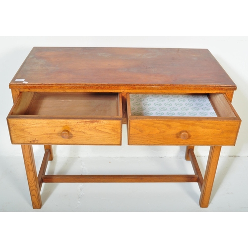 1227 - A retro vintage mid 20th century stamped Air Ministry golden oak office desk. The desk having a stra... 