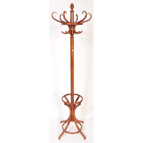 1235 - A retro vintage mid 20th Century bentwood coat stand / hat rack in the manner of Thonet. Having a ta... 