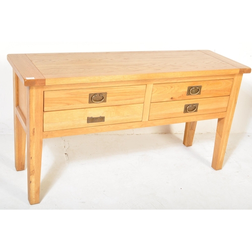 1236 - A Contemporary  modernist chunky oak furniture land sideboard. Raised on squared legs with fitted 4 ... 