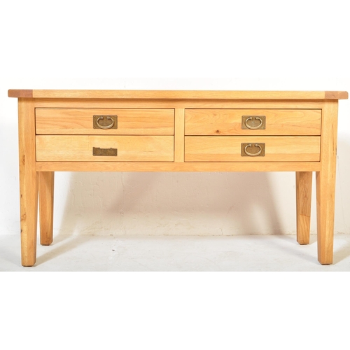 1236 - A Contemporary  modernist chunky oak furniture land sideboard. Raised on squared legs with fitted 4 ... 