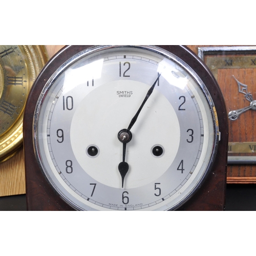 1241 - An assortment of three vintage retro mid 20th century mantel clocks to include a Smiths Bakelite man... 