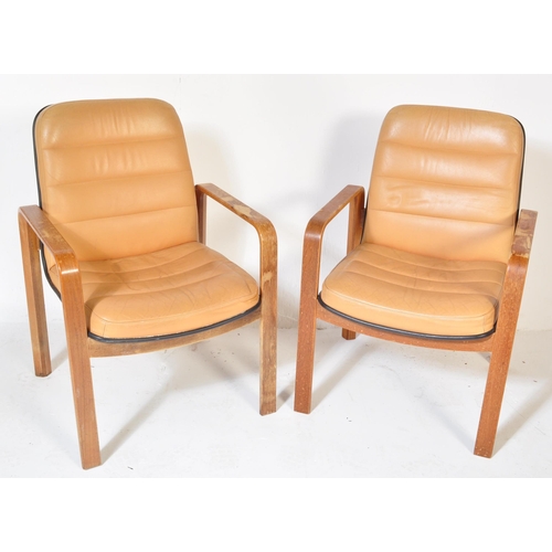 1248 - A pair of retro vintage 20th century leather & wooden office chairs. Each having a square beige leat... 