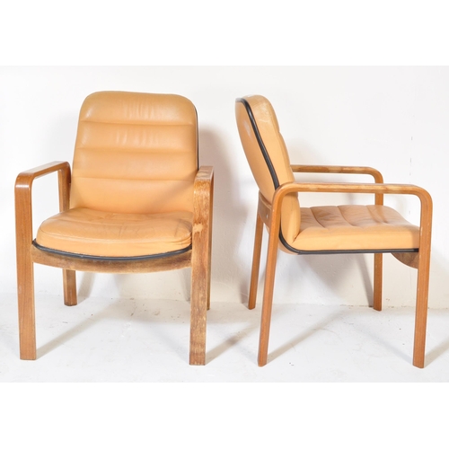 1248 - A pair of retro vintage 20th century leather & wooden office chairs. Each having a square beige leat... 