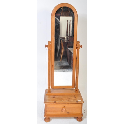 1249 - A retro vintage 20th Century pine wood full length pedestal cheval mirror. Having an arched cheval s... 