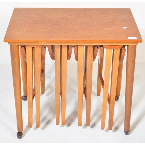 1252 - Poul Hundevad. A 1960's Danish inspired drop leaf teak veneered quartetto nest of tables featuring f... 