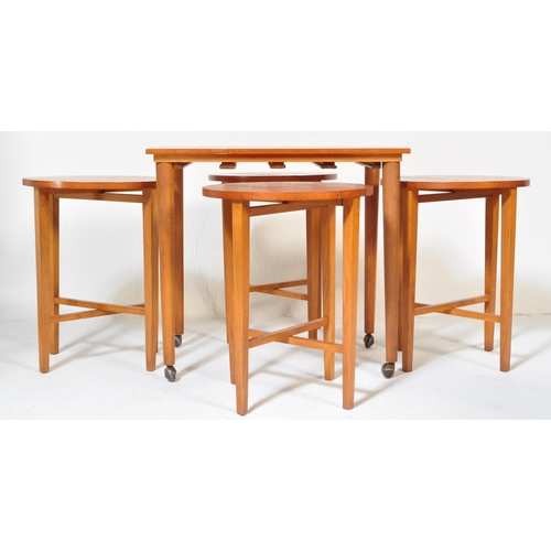 1252 - Poul Hundevad. A 1960's Danish inspired drop leaf teak veneered quartetto nest of tables featuring f... 