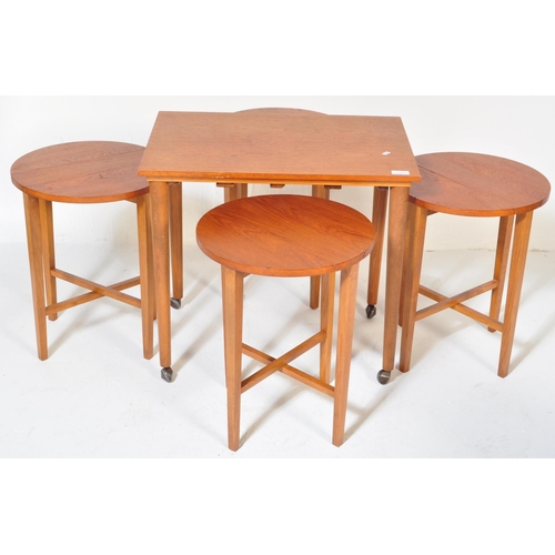 1252 - Poul Hundevad. A 1960's Danish inspired drop leaf teak veneered quartetto nest of tables featuring f... 