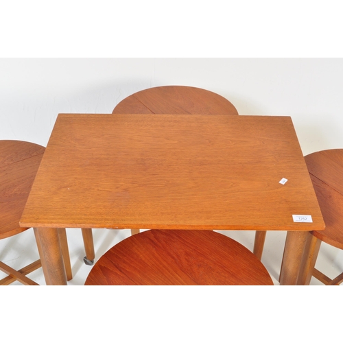 1252 - Poul Hundevad. A 1960's Danish inspired drop leaf teak veneered quartetto nest of tables featuring f... 