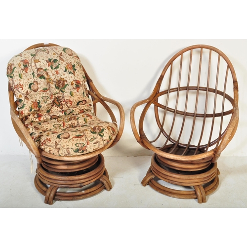 1255 - A pair of retro 1970's / 1980'S bamboo and wicker / cane swivel armchairs / egg chairs. The chairs  ... 