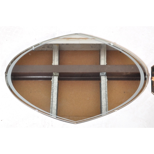 1256 - A pair of retro vintage mid 20th Century wall hanging mirrors. One having bevelled edge on wood back... 