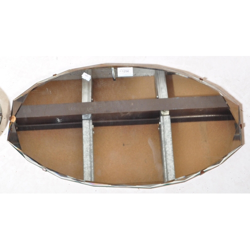 1256 - A pair of retro vintage mid 20th Century wall hanging mirrors. One having bevelled edge on wood back... 