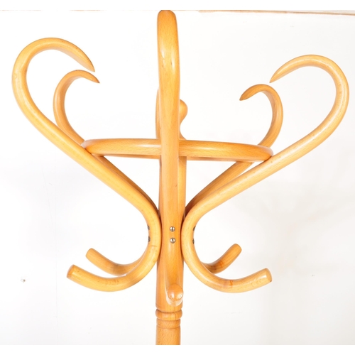 1257 - A vintage mid 20th Century Thonet bentwood coat stand rack having curved S hooks to the top over a s... 