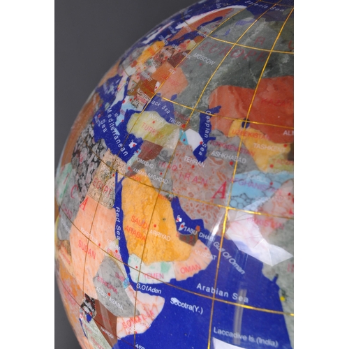 1259 - A retro vintage 20th Century gemstone globe. Having various semi precious stones and minerals repres... 