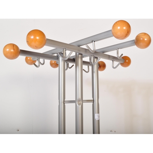 1265 - A vintage 20th Century tubular metal and wood freestanding coat stand. Having eight wood ball ends, ... 