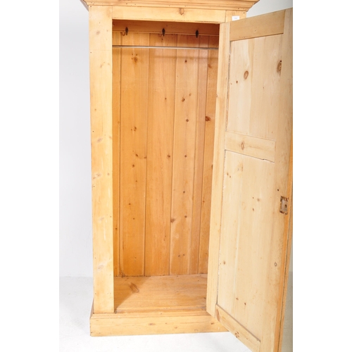 1269 - A retro Victorian 19th century pine hall cupboard. The hall wardrobe having a pediment top over a si... 