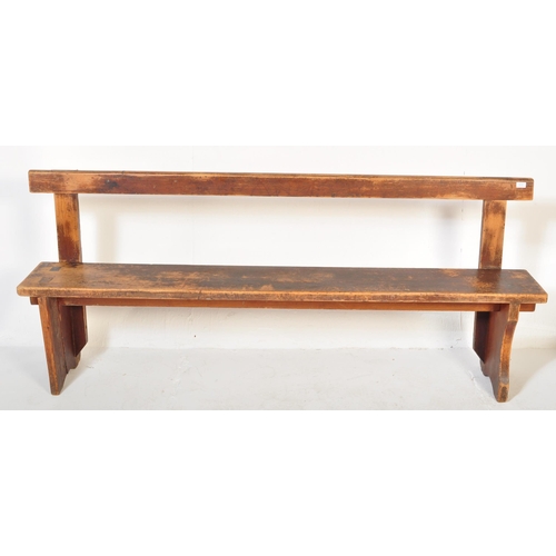 1273 - An early 20th century stained pained and waxed railway station type bench. The bench  having a strai... 