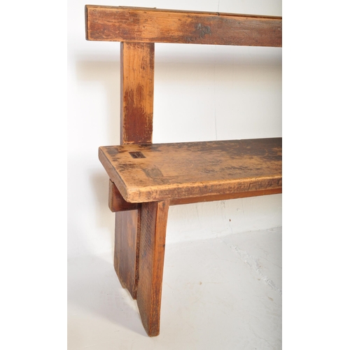 1273 - An early 20th century stained pained and waxed railway station type bench. The bench  having a strai... 