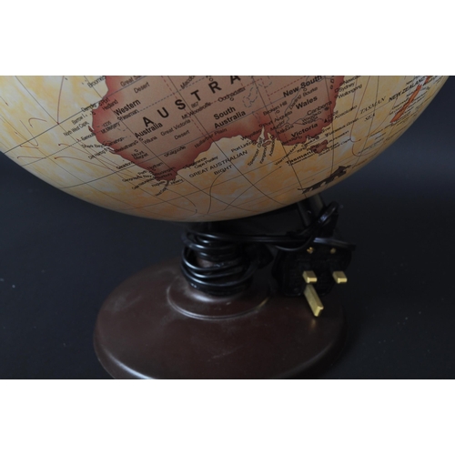 1275 - A contemporary antique style illuminating globe. A spherical form with brown circular base. Globes b... 