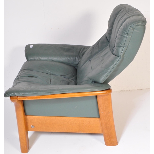 1276 - A retro vintage mid 20th Century original Stressless Ekornes reclining armchair. With green leather ... 