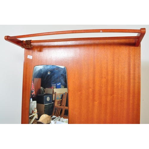 1277 - A retro vintage mid 20th Century teak wood hall stand. With twin hanging rails to top, mirror to lef... 