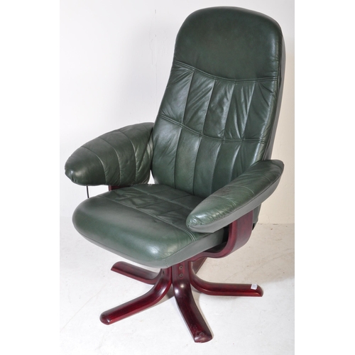 1278 - A retro vintage 20th Century swivel reclining desk office armchair. Having green leather back, armre... 