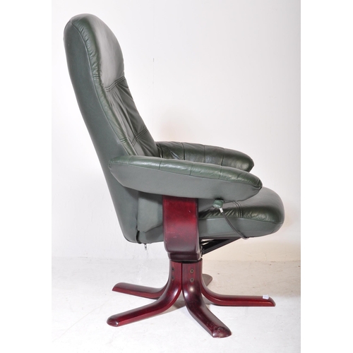 1278 - A retro vintage 20th Century swivel reclining desk office armchair. Having green leather back, armre... 