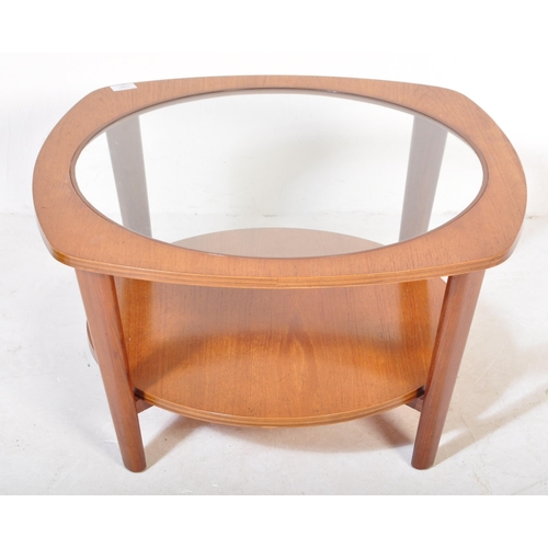 1280 - Manner of G-Plan Furniture. A Mid-century teak wood Astro style coffee occasional table with glass c... 