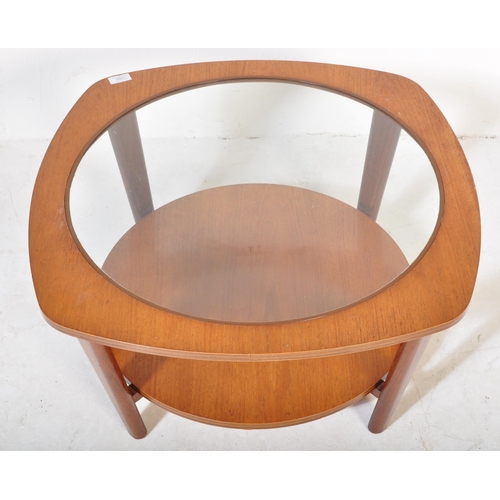 1280 - Manner of G-Plan Furniture. A Mid-century teak wood Astro style coffee occasional table with glass c... 