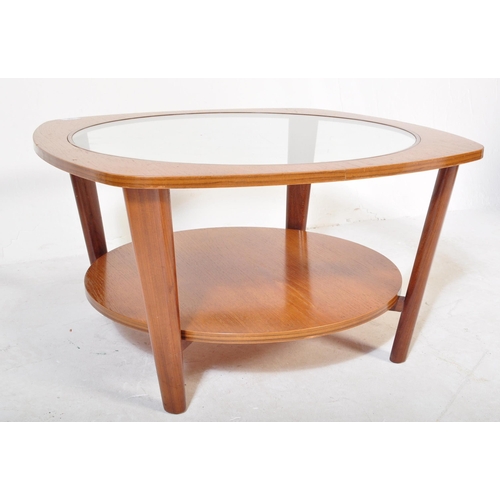 1280 - Manner of G-Plan Furniture. A Mid-century teak wood Astro style coffee occasional table with glass c... 