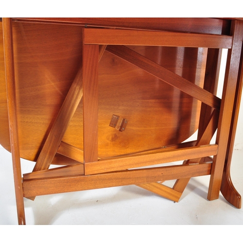 1281 - Mid-century teak wood space saver drop leaf dining table together with a set of teak wood rail back ... 