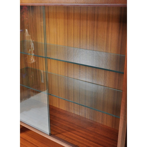 1282 - A Mid-century teak wood upright modular cabinet with corner sectional unit. Glass shelves and doors ... 