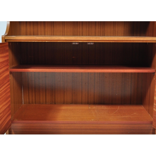 1282 - A Mid-century teak wood upright modular cabinet with corner sectional unit. Glass shelves and doors ... 