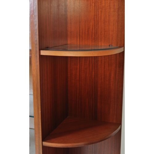 1282 - A Mid-century teak wood upright modular cabinet with corner sectional unit. Glass shelves and doors ... 