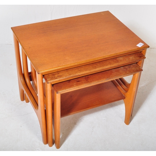 1284 - A mid-century teak wood Danish manner nest of tables. Raised on shaped supports with returns, each w... 