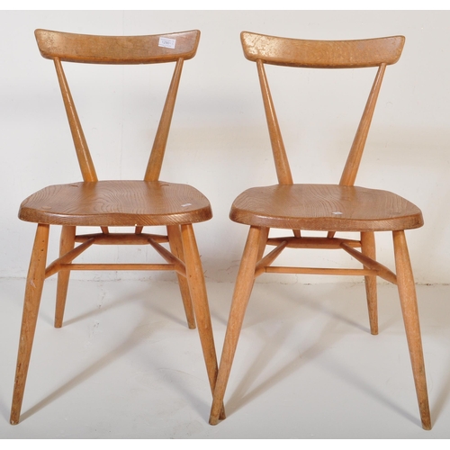 1290 - A pair of retro vintage mid 20th Century circa 1960s Ercol stacking chairs. Single slat back rest, w... 