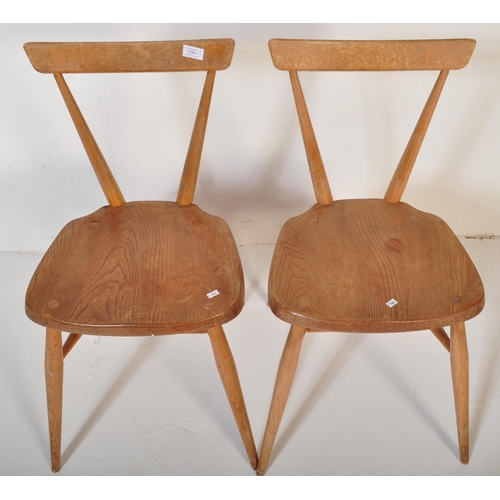 1290 - A pair of retro vintage mid 20th Century circa 1960s Ercol stacking chairs. Single slat back rest, w... 