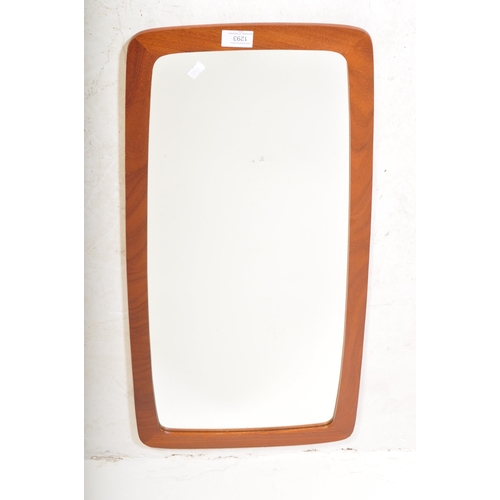 1293 - A vintage retro mid 20th century atomic style teak wall mirror having shaped wood back and mirror gl... 