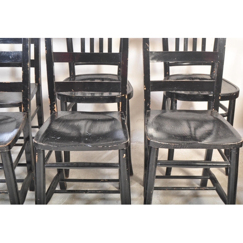 1309 - A collection of eight 20th century ebonised dining chairs. Each being painted in a black gloss with ... 