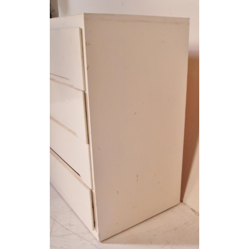 1316 - A vintage retro 20th century chest of drawers painted in a white colourway with a series of four dra... 