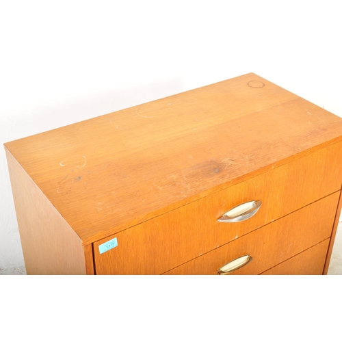 1318 - Mid century British teak veneer pedestal chest of drawers. Raised on tapering turned legs with an up... 