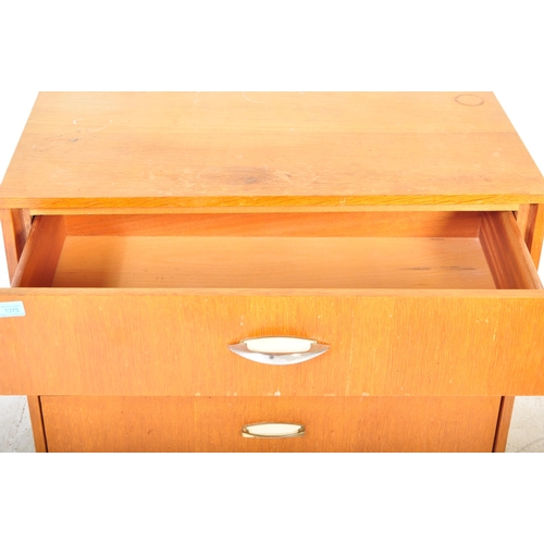 1318 - Mid century British teak veneer pedestal chest of drawers. Raised on tapering turned legs with an up... 