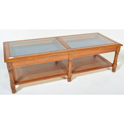 1323 - A retro vintage mid 20th Century glazed teak coffee table. Of rectangular form having two sectional ... 