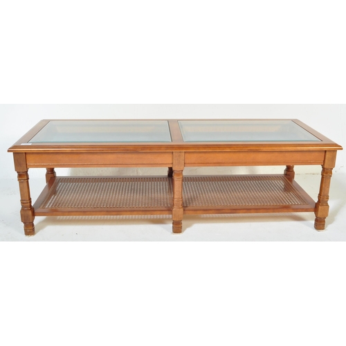 1323 - A retro vintage mid 20th Century glazed teak coffee table. Of rectangular form having two sectional ... 