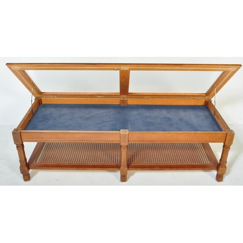 1323 - A retro vintage mid 20th Century glazed teak coffee table. Of rectangular form having two sectional ... 