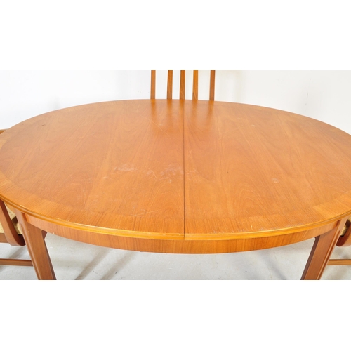 1325 - William Lawrence - A retro vintage mid 20th Century teak extended dining table and chairs. Of oval f... 