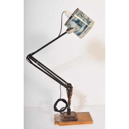 1328 - A retro vintage 20th Century Anglepoise type lamp light. Having a recycled tin shade, with ebonised ... 