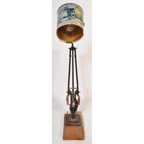 1328 - A retro vintage 20th Century Anglepoise type lamp light. Having a recycled tin shade, with ebonised ... 