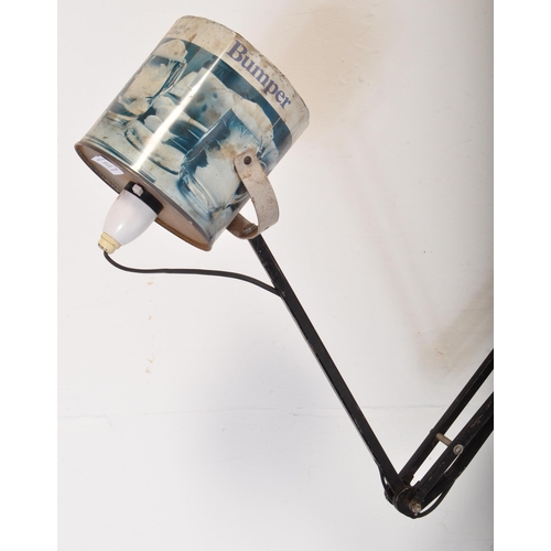 1328 - A retro vintage 20th Century Anglepoise type lamp light. Having a recycled tin shade, with ebonised ... 